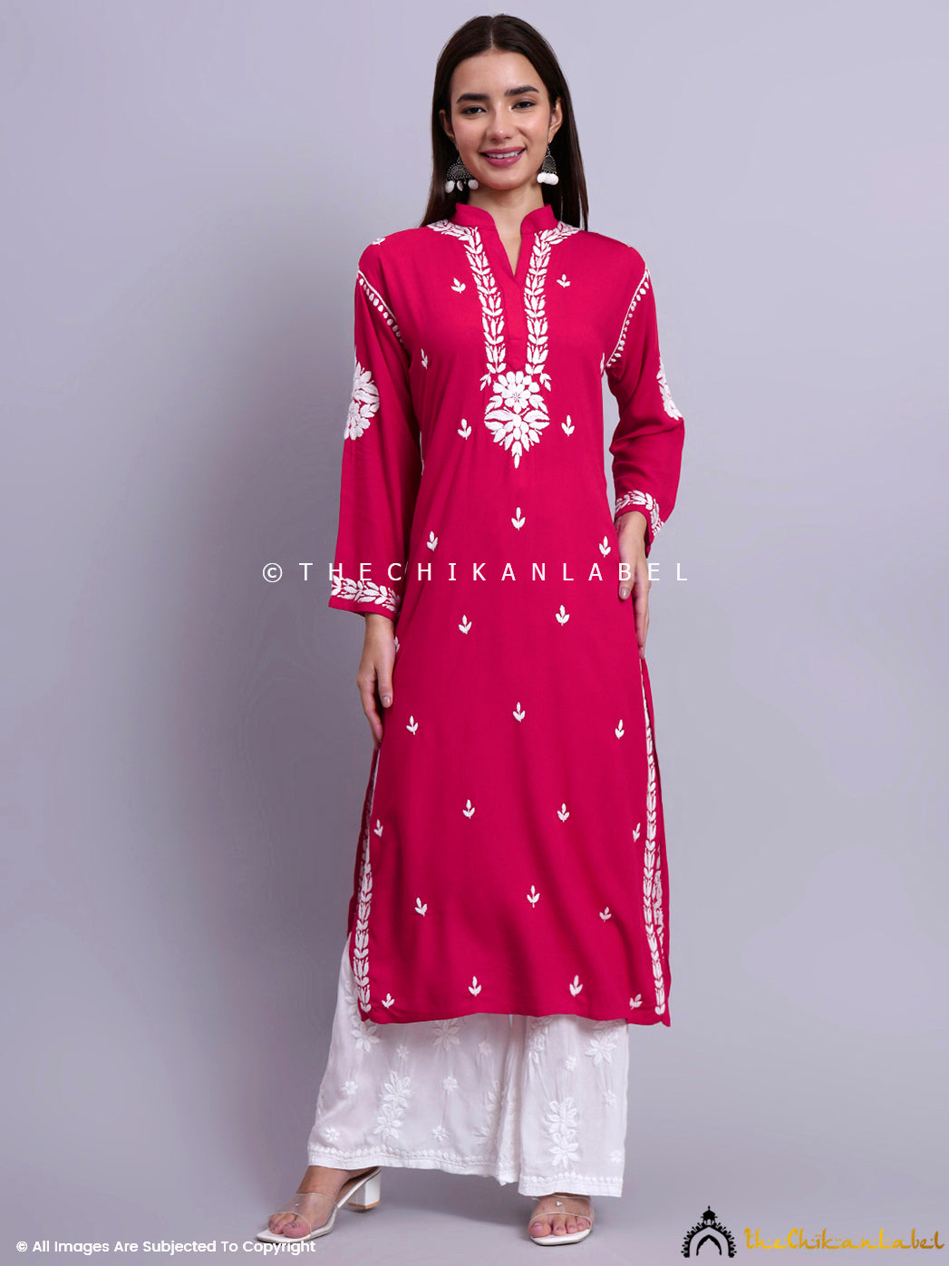 Hand-embroidered straight kurti styled with subtle accessories and ethnic palazzos for a modern desi look.