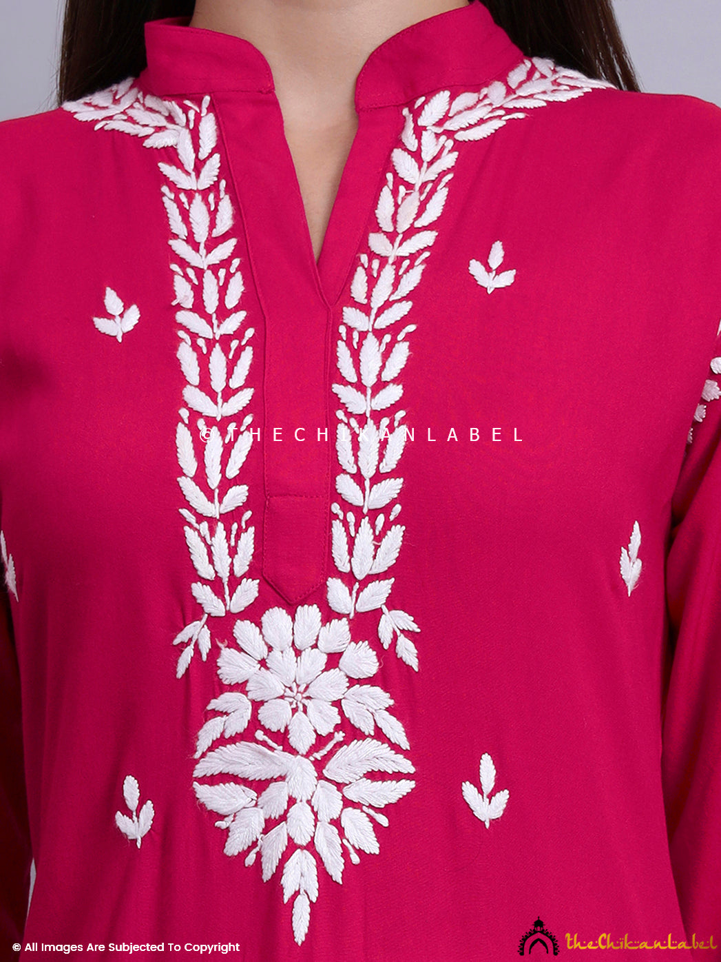 Kurti with handcrafted Lucknowi embroidery, mandarin neckline, and full sleeves styled for casual wear.