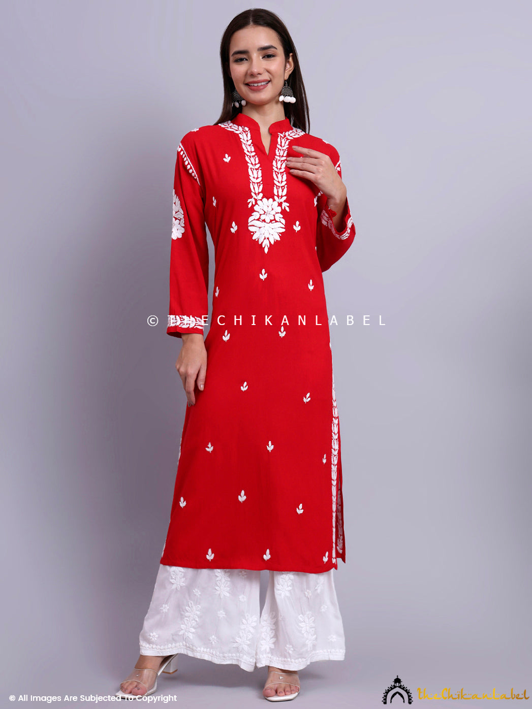 Traditional Indian outfit with straight fit kurti and detailed hand embroidery suitable for office wear.