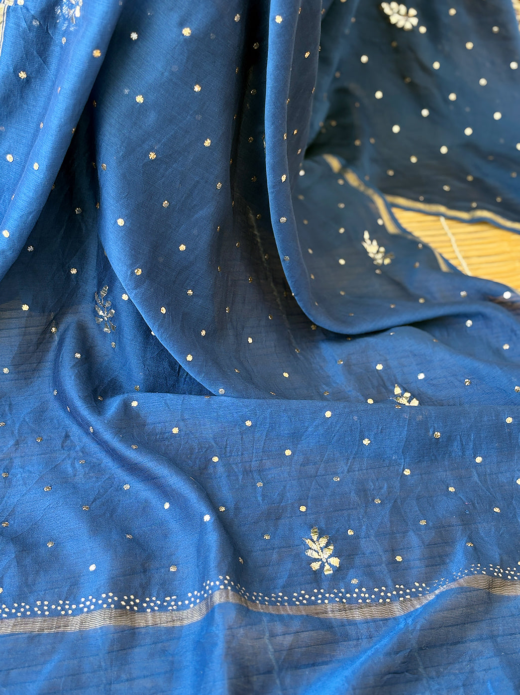 Anarkali style semi-stitched kurti set with hand-embroidered motifs and light mukaish work displayed on textured background