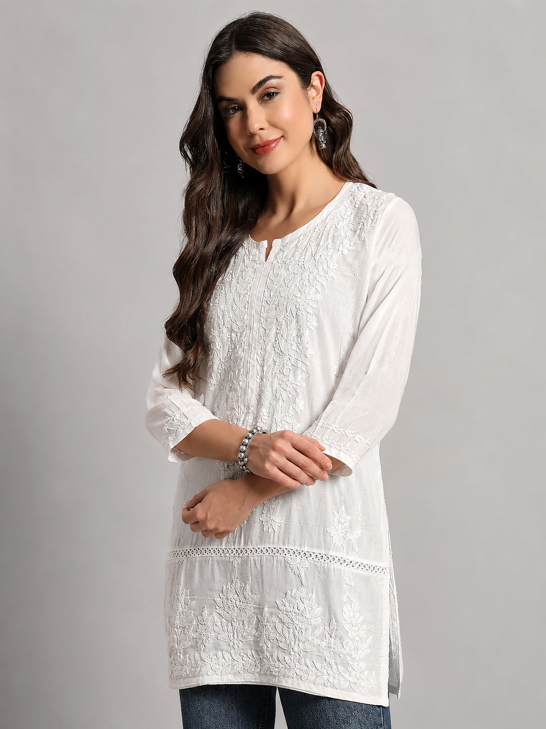 Designer Chikankari top with detailed floral embroidery on neckline, front panel, sleeves, and border for an elegant traditional appearance