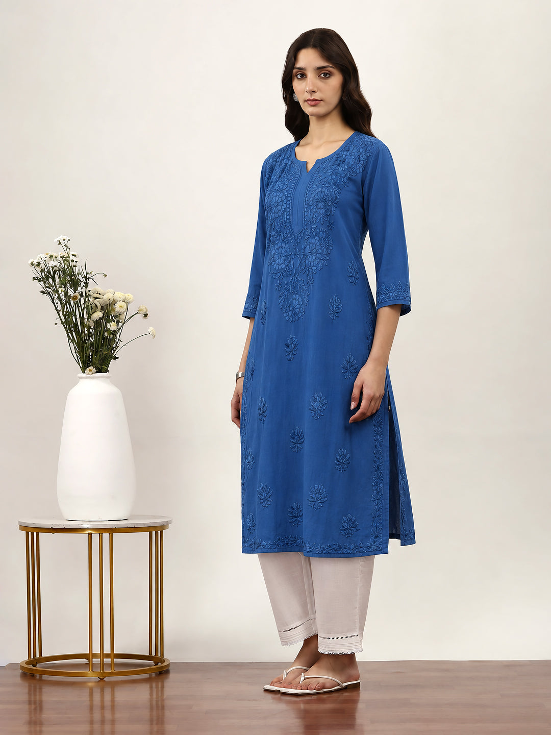 Saanvika Rayon Straight Kurta with traditional Chikankari embroidery, round neckline with front slit detail and sophisticated straight-fit design