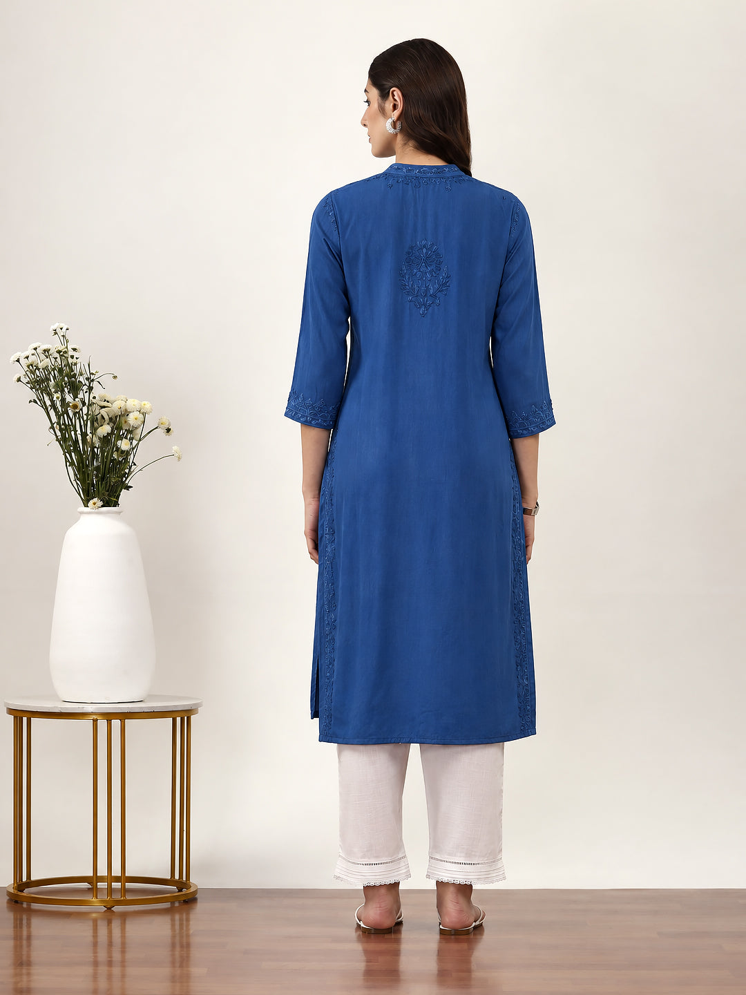 Elegant Chikankari kurti for women featuring intricate floral embroidery, rayon fabric, straight cut silhouette and comfortable three-quarter sleeves
