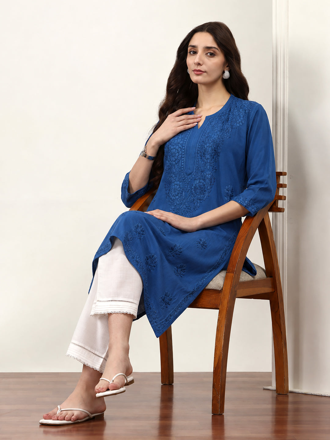 Comfortable regular wear kurti for women featuring detailed Chikankari embroidery, soft rayon fabric, straight silhouette and three-quarter sleeves