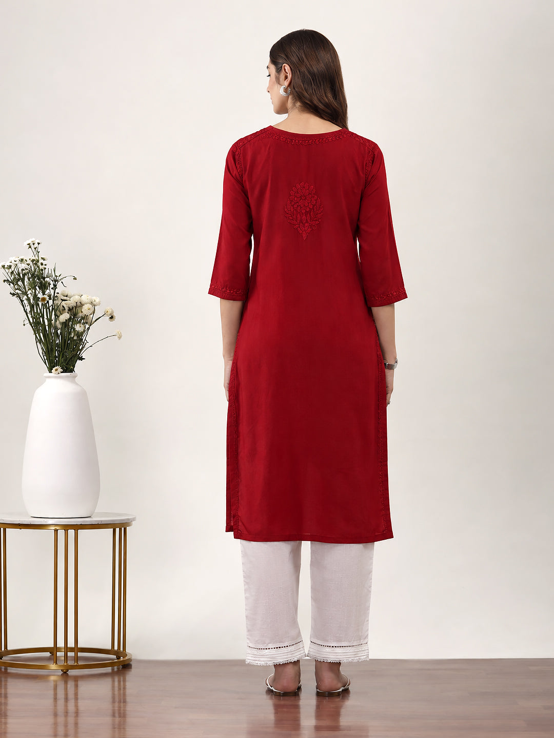 Trending kurta for women featuring traditional Chikankari embroidery, comfortable rayon fabric, straight fit and a stylish round neckline with front slit