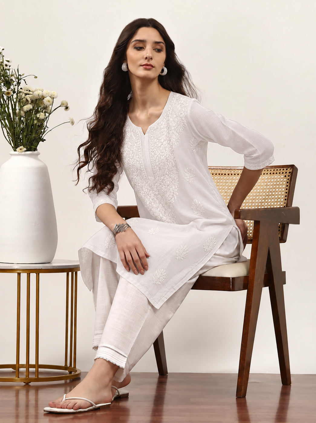 Trending Chikankari kurta for women with intricate floral embroidery, straight-cut silhouette, three-quarter sleeves and an elegant neckline for versatile styling