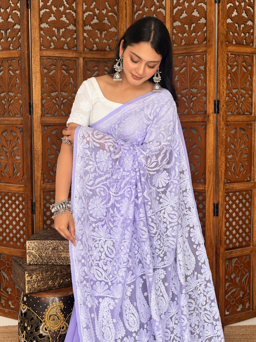 Sahira Georgette Half Jaal Saree displayed on a model, showcasing an embroidered pallu, delicate leafy patterns and scattered floral motifs across the pleats.