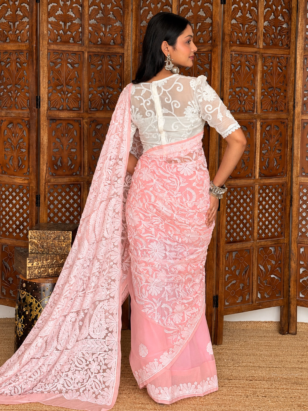 Sahira Georgette Half Jaal Saree showing a flowing silhouette, embroidered hem border and floral vine patterns across the shoulder drape.