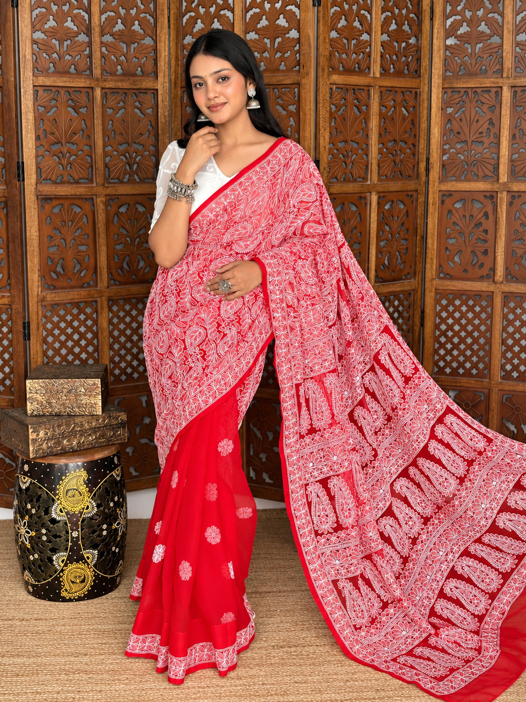 Sahira Chikankari saree displayed with neatly arranged front pleats, scattered flower motifs and an intricately embroidered pallu framing the model.