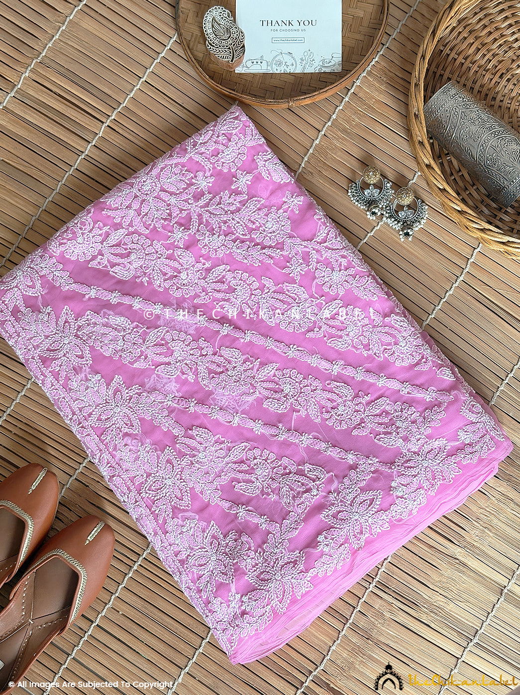 Trendy traditional saree look captured indoors, highlighting the intricate chikankari embroidery and soft draping of premium-quality georgette material.