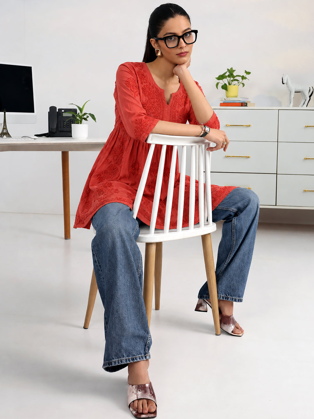 Women's embroidered short A-line kurti crafted from viscose silk fabric, featuring traditional Chikankari-inspired floral patterns and an elegant design for ethnic styling.