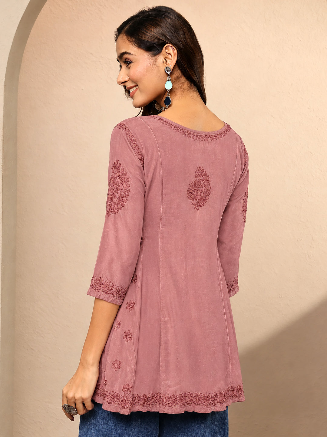 Comfortable regular wear kurti for women featuring viscose silk fabric, floral Chikankari-style embroidery, a short A-line shape, and versatile styling for casual outings.