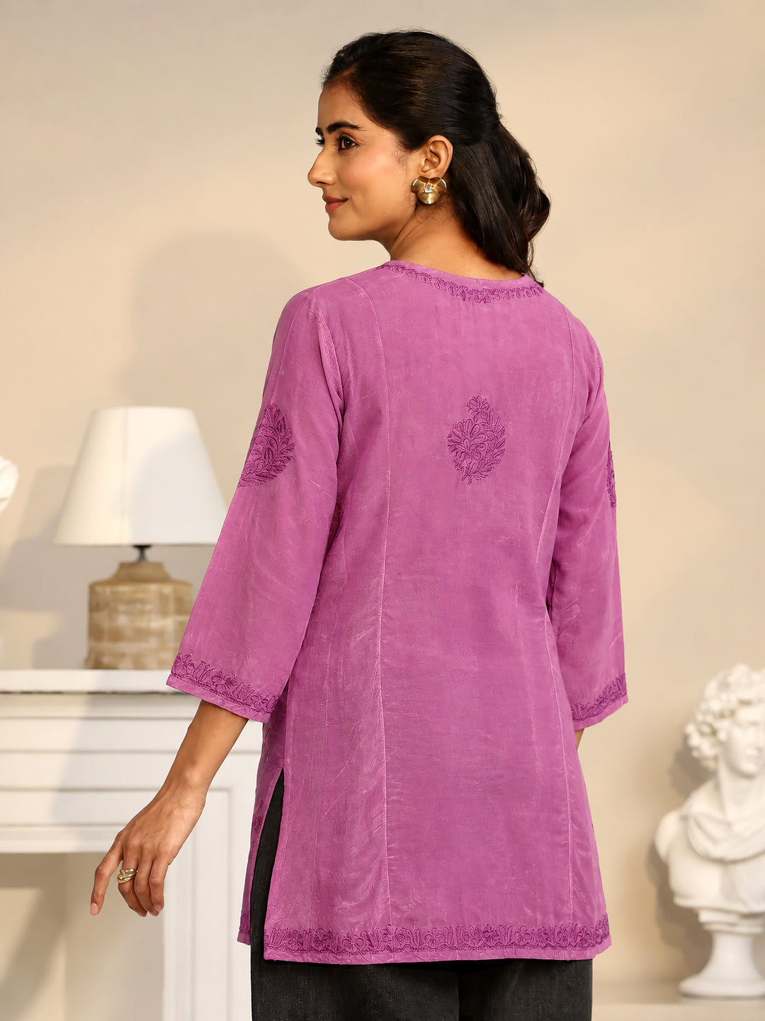 Elegant festive wear kurti featuring intricate floral thread embroidery, a decorative front yoke, an A-line cut, and three-quarter sleeves for celebrations and family gatherings.