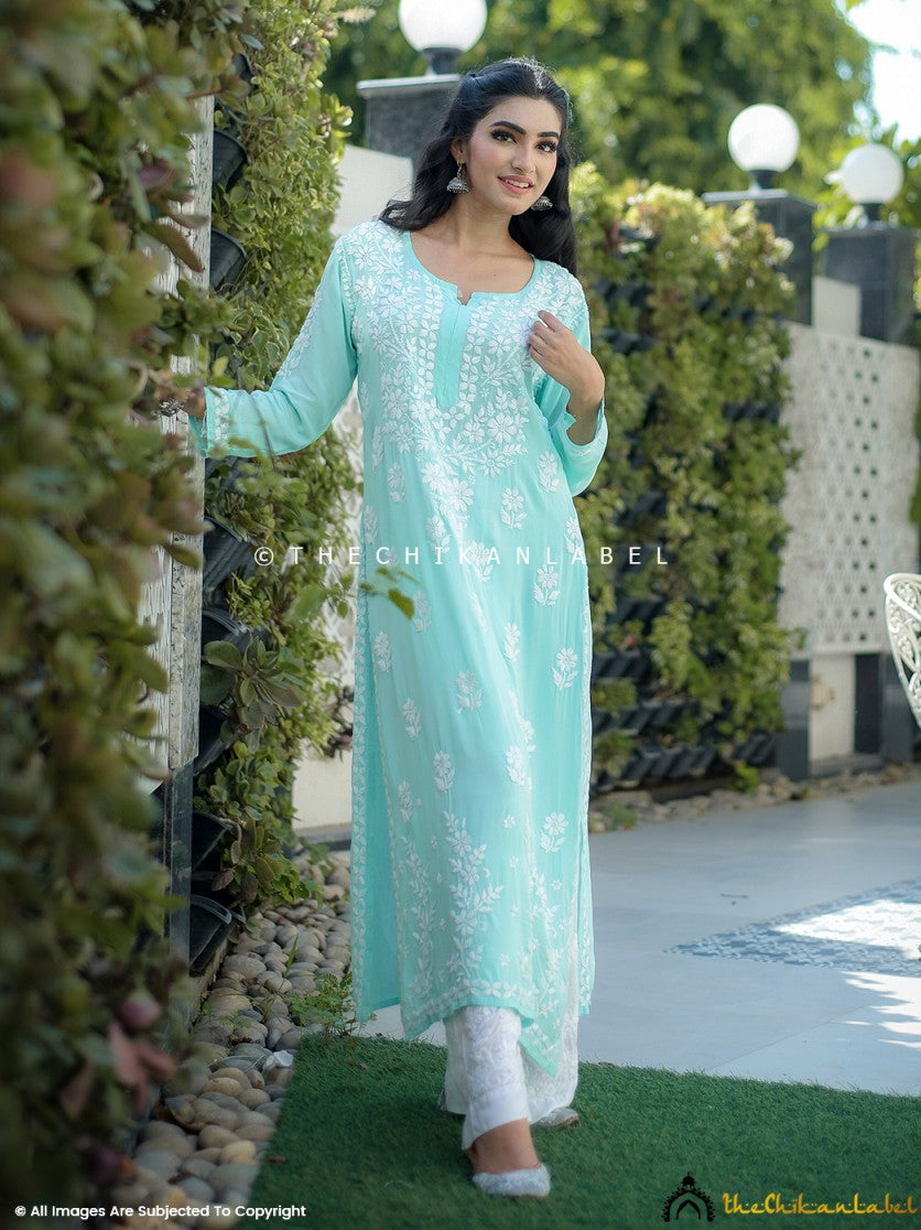 Woman wearing sea green modal chikankari straight kurti