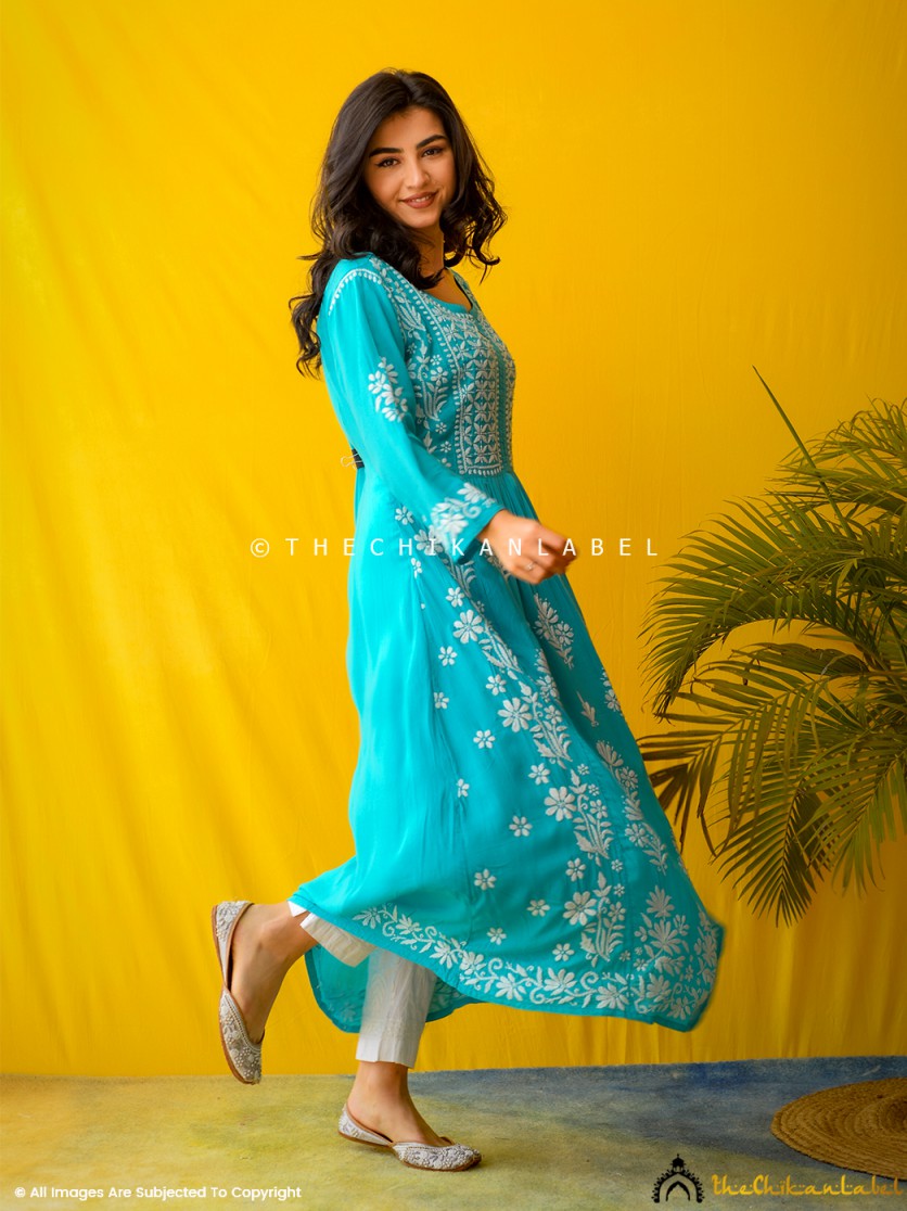 Model in Zinia Modal Chikankari Kurti posing against a yellow backdrop