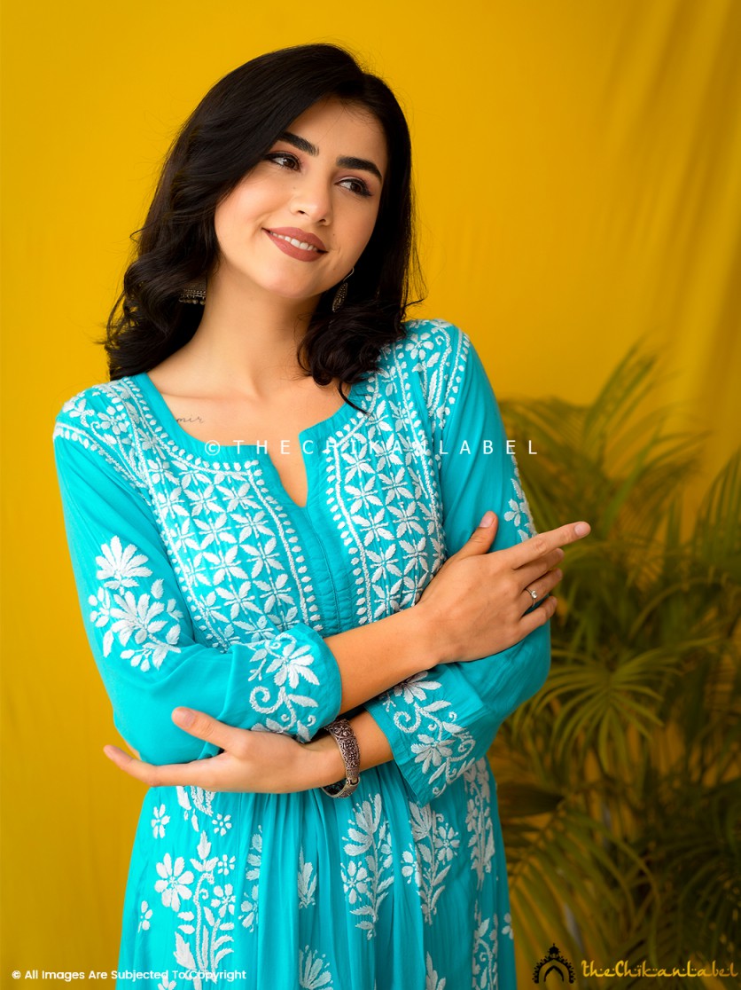 Close-up of chikankari embroidery on sea green modal kurti
