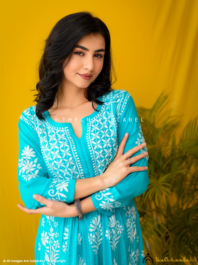 Sea green modal chikankari kurti styled with juttis