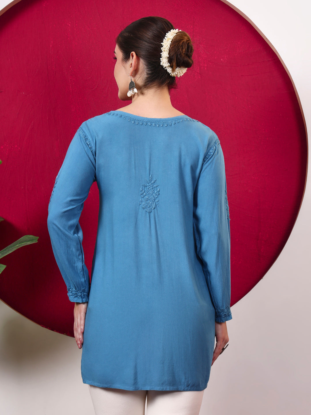 Women’s Chikankari top in soft rayon fabric with intricate floral embroidery across the neckline, front, sleeves and hem, designed as a stylish and comfortable regular wear kurta.