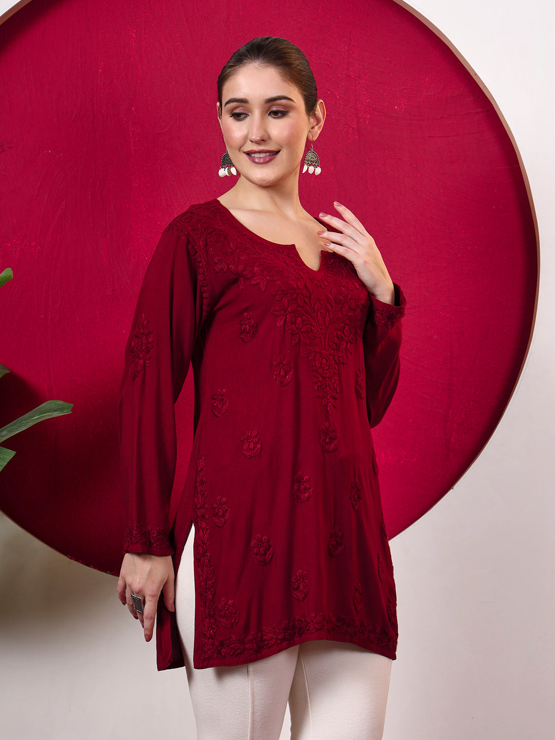 Female fashion model wearing a trending Chikankari top with intricate embroidery, full-length sleeves and soft rayon fabric, designed for comfortable everyday ethnic dressing.