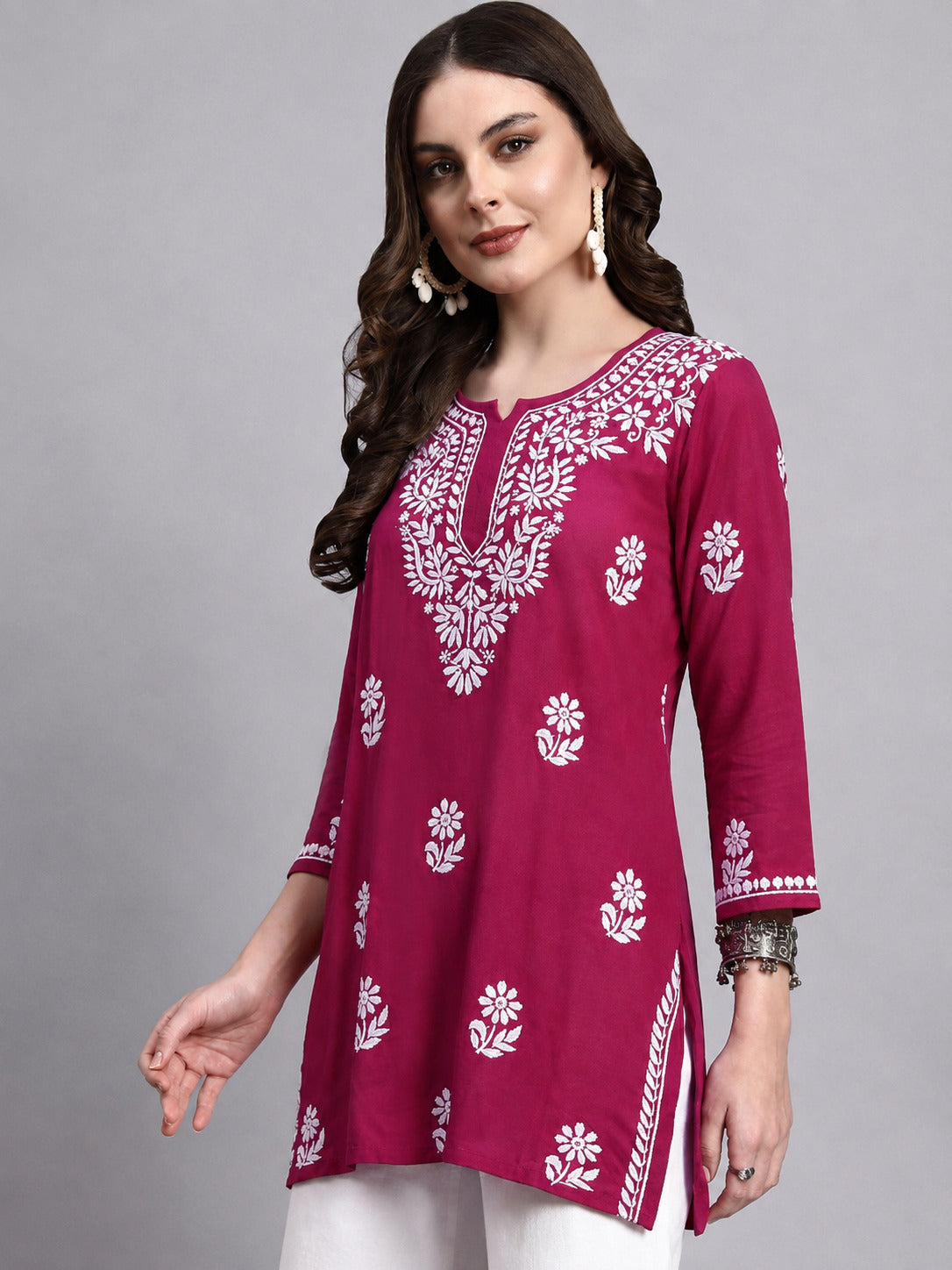 Comfortable regular wear Chikankari top for women with detailed embroidery across the neckline, sleeves and body, perfect for casual outings and everyday styling.