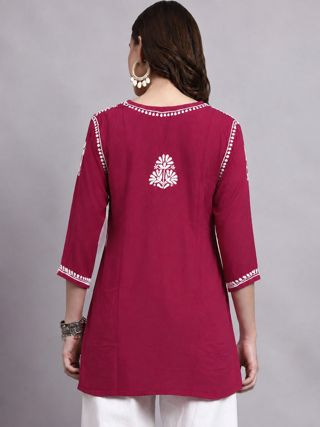 Traditional Chikankari short kurti for women made from soft rayon fabric with embroidered floral motifs and an easy relaxed fit for all-day comfort.