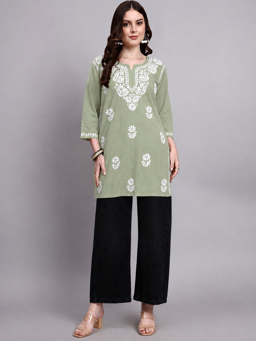 Women’s Chikankari short kurti in soft rayon fabric featuring traditional floral embroidery and a relaxed short-length silhouette for office and casual wear.