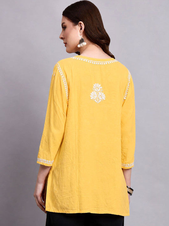 Women’s Chikankari short kurti in soft rayon fabric featuring traditional floral embroidery and a relaxed short-length silhouette for office and casual wear.
