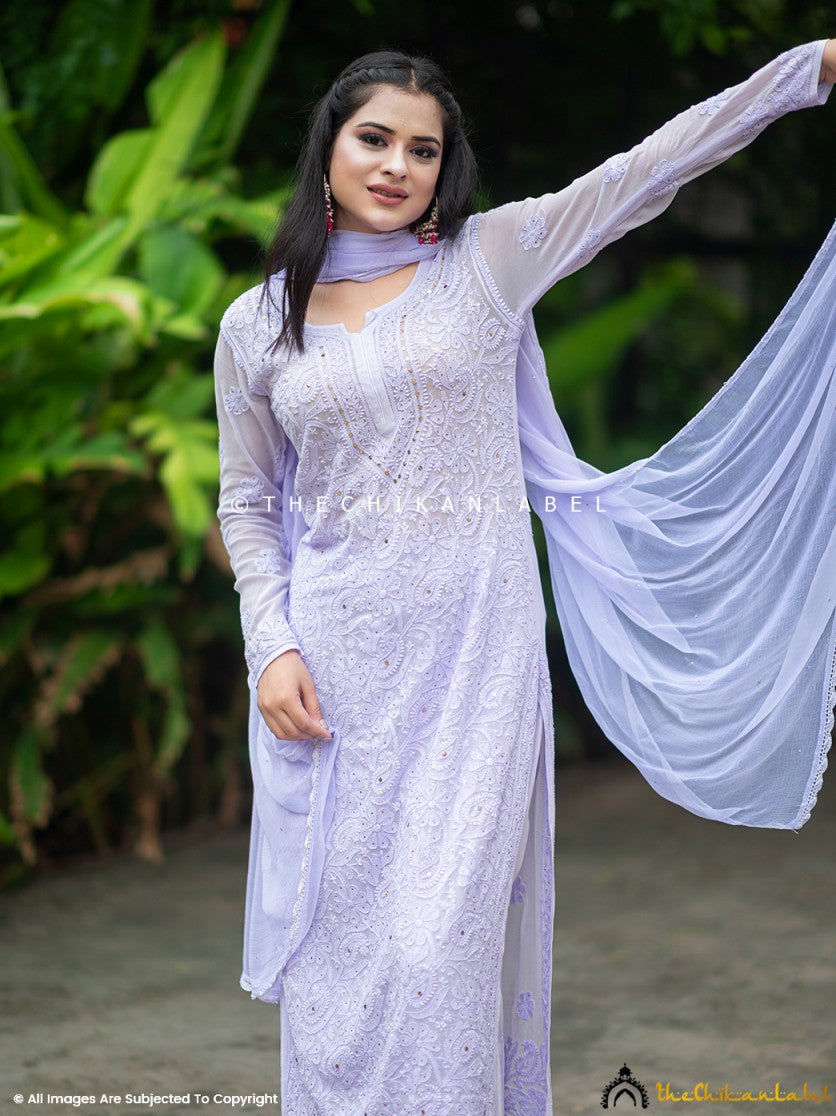 Traditional chikankari kurti palazzo set in viscose fabric, featuring sheer dupatta and mukaish accents for festive styling.