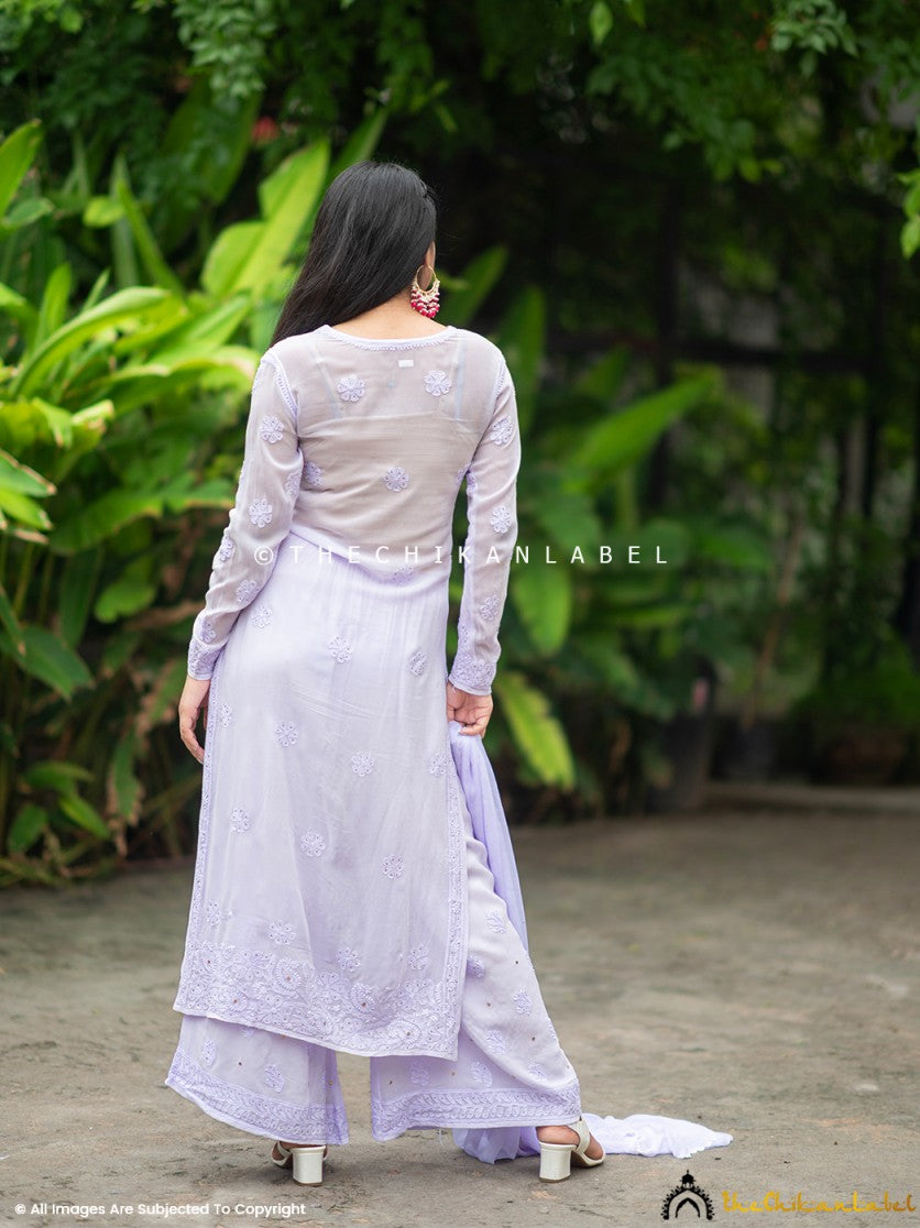 Close-up of artisanal mukaish and chikankari embroidery on a viscose kurti, styled with wide palazzos and a flowing dupatta.