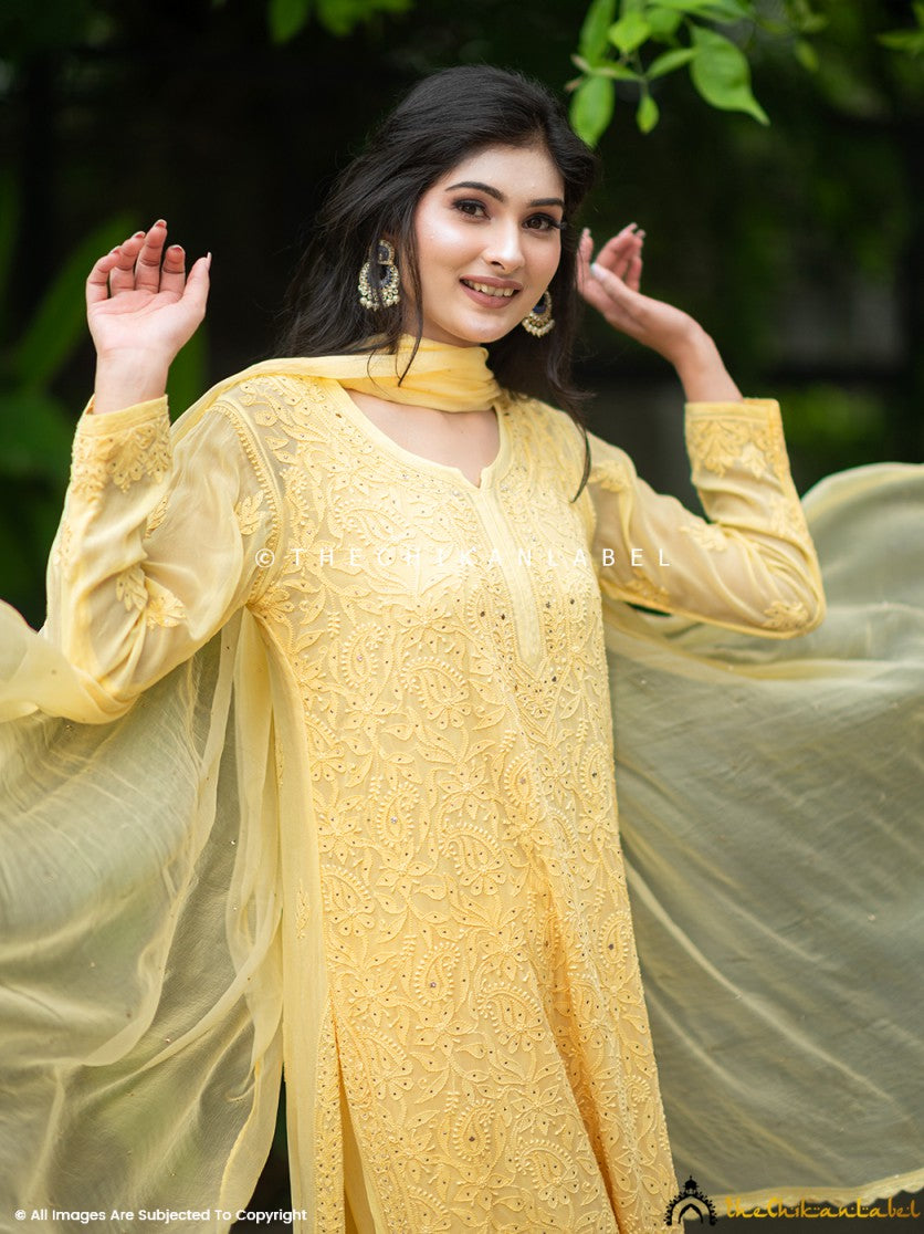 Chikankari viscose kurti palazzo set featuring handcrafted embroidery and mukaish embellishments, styled with a matching dupatta.