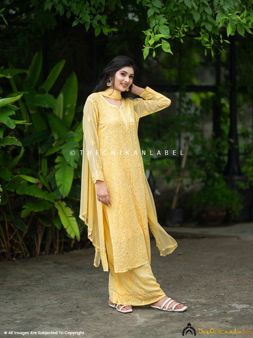 Artisan-crafted mukaish work viscose set styled with traditional jewelry and soft drape dupatta, ideal for luxury occasions.