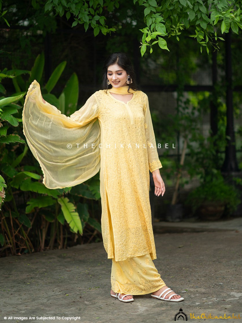 Elegant chikankari viscose kurti palazzo outfit with metallic mukaish accents, paired with a flowy dupatta for a festive look.