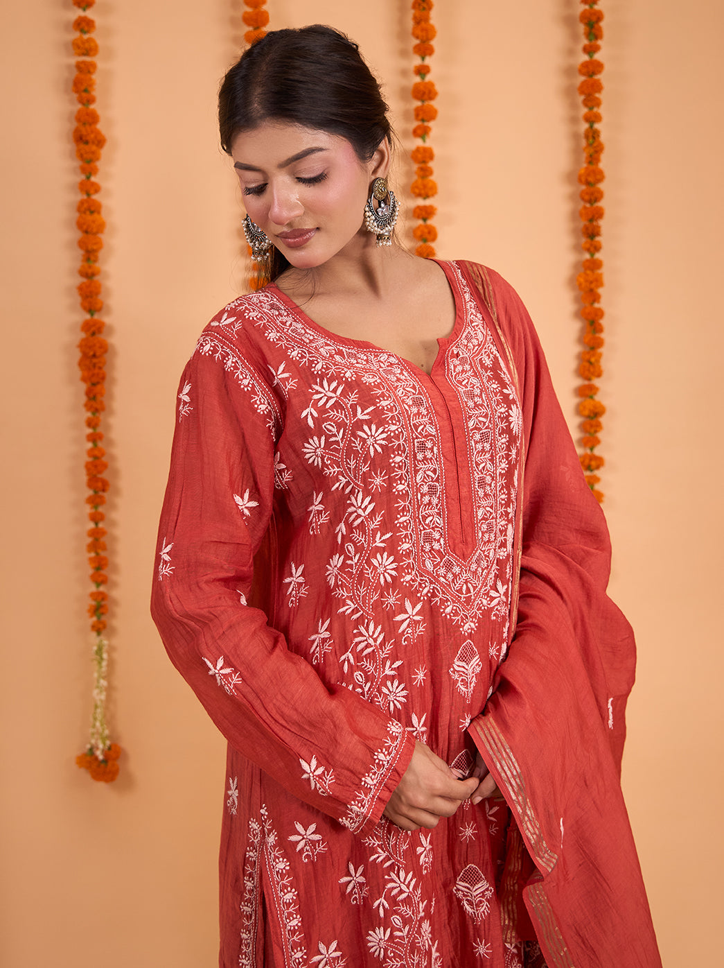 Sofia Kurta Set with Dupatta featuring a rounded neckline with an elongated embroidered slit panel, floral sleeve motifs and matching embroidered palazzo pants.
