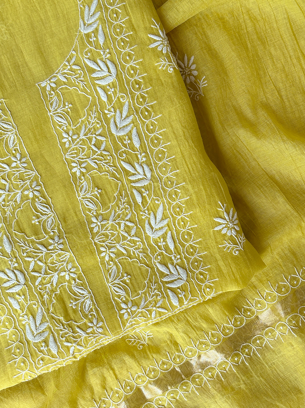 Premium mul chanderi unstitched kurti piece featuring intricate chikankari embroidery panel with coordinated dupatta showcasing fine artisan craftsmanship