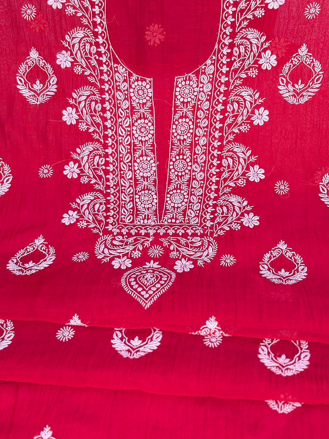 Unstitched chikankari kurti piece crafted in mul chanderi fabric featuring detailed floral embroidery work