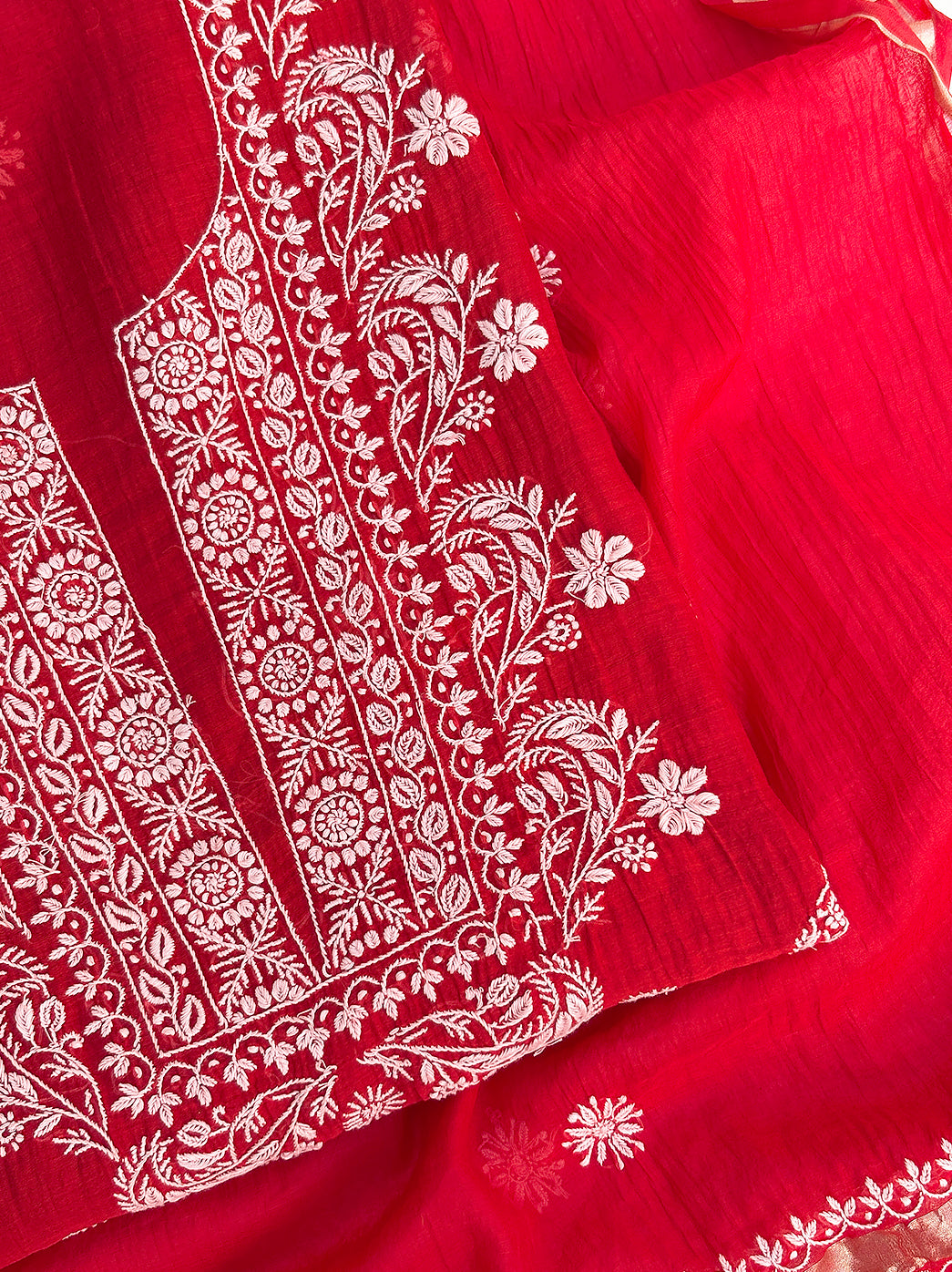 Traditional unstitched chikankari kurti piece with embroidered neckline and dupatta for festive styling