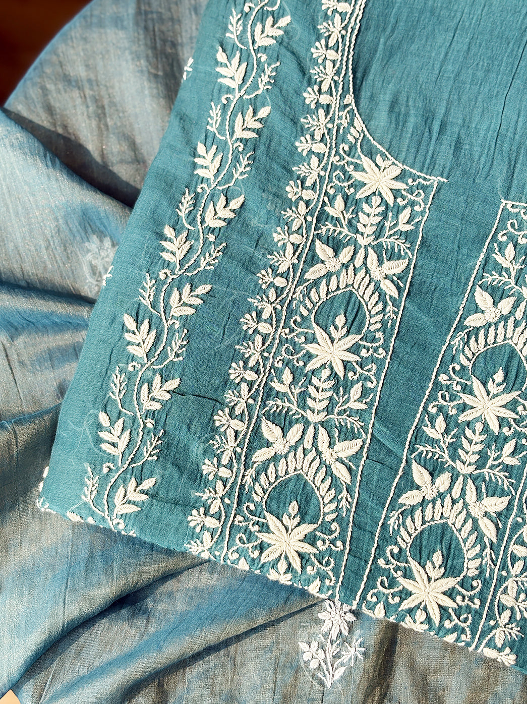 Mul Chanderi kurti and dupatta set photographed to highlight artisanal Chikankari craftsmanship and premium texture.