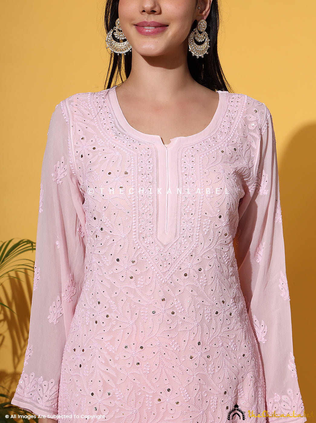 Chikankari viscose kurti palazzo set featuring handcrafted embroidery and mukaish embellishments, styled with a matching dupatta.