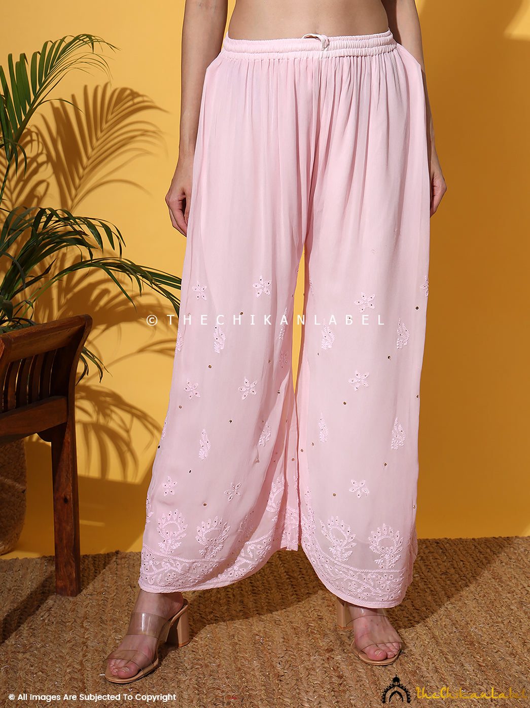 Artisan-crafted mukaish work viscose set styled with traditional jewelry and soft drape dupatta, ideal for luxury occasions.