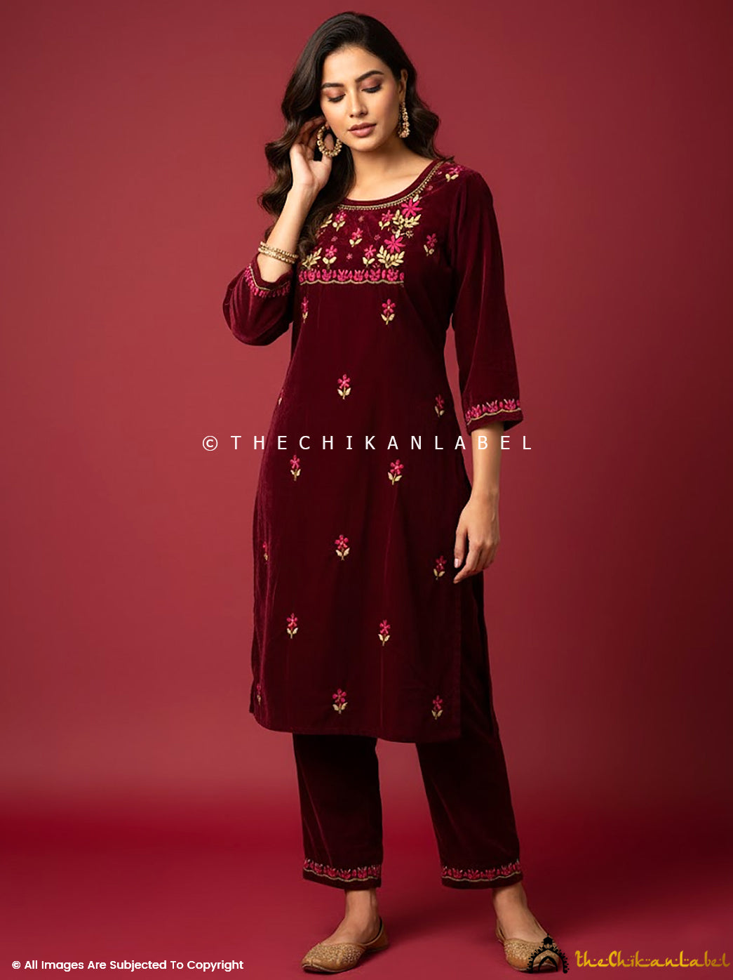 Designer velvet chikankari kurta set featuring detailed yoke embroidery and straight pants ideal for festive ethnic wear.