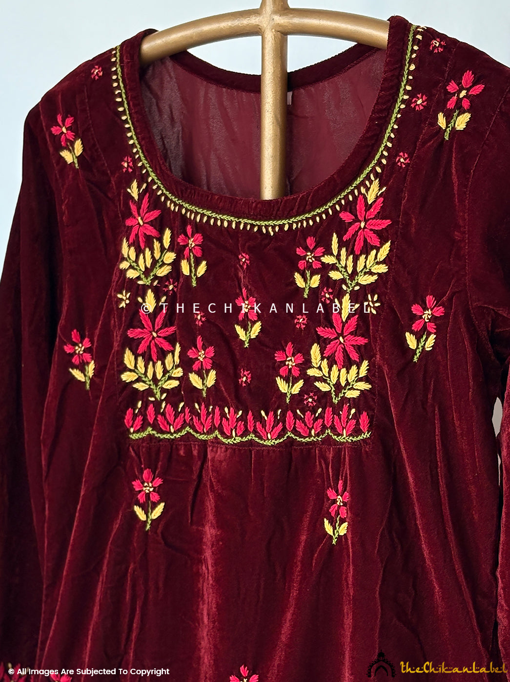 Festive velvet chikankari straight kurta set highlighting hand-embroidered motifs and traditional craftsmanship.
