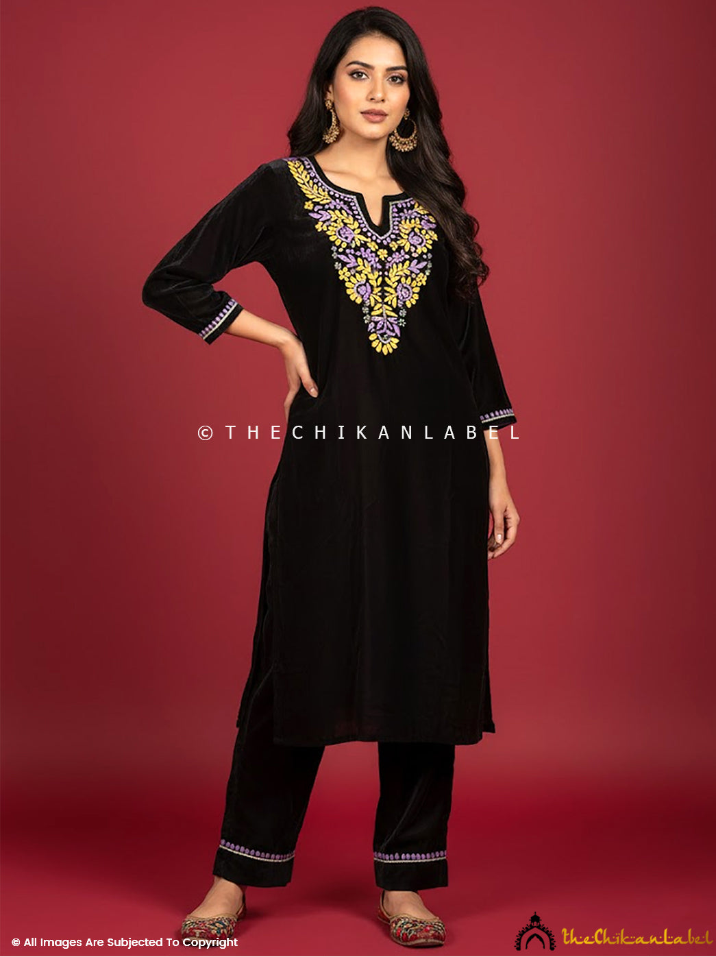 Premium velvet chikankari straight kurta set with intricate handcrafted embroidery displayed on a model for festive and winter wear.