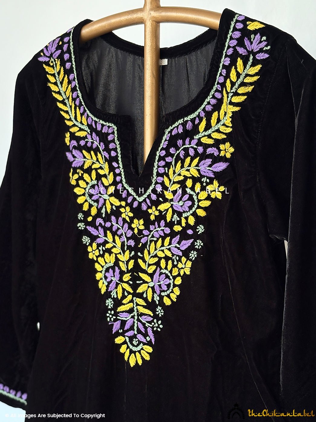 Luxury velvet chikankari kurta outfit with handcrafted floral threadwork perfect for weddings, parties, and winter celebrations.