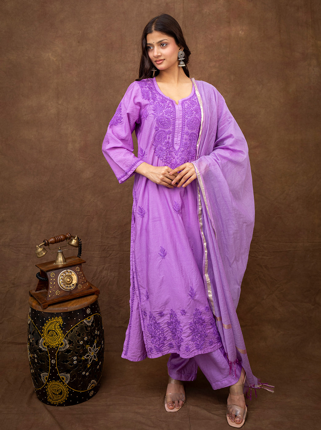 Woman wearing Tiya Chanderi chikankari kurta set with dupatta featuring intricate hand embroidery and straight silhouette for festive wear