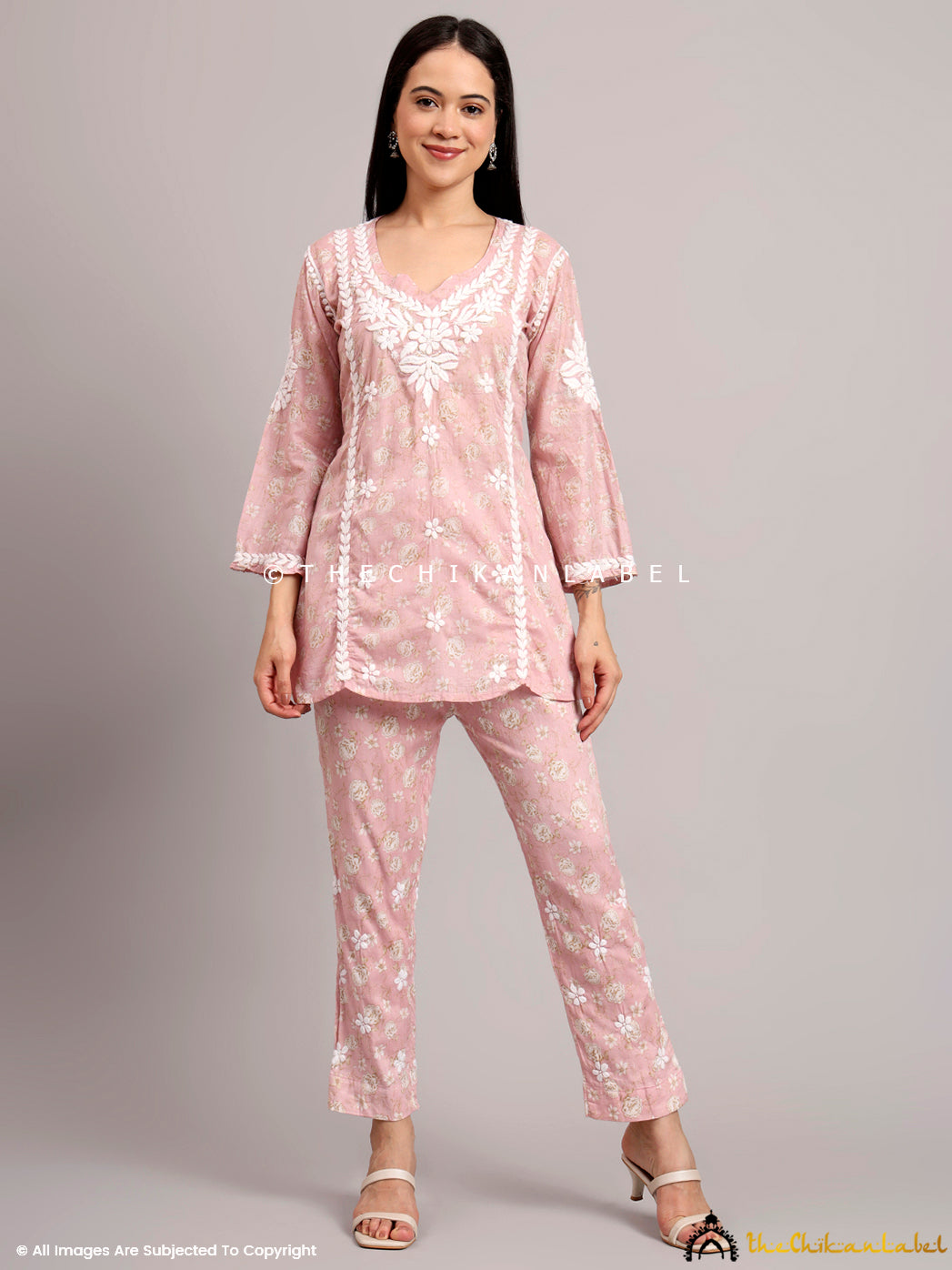 Model wearing a mulmul cotton printed co-ord set featuring handcrafted Chikankari embroidery and paired straight pants for a coordinated ethnic look