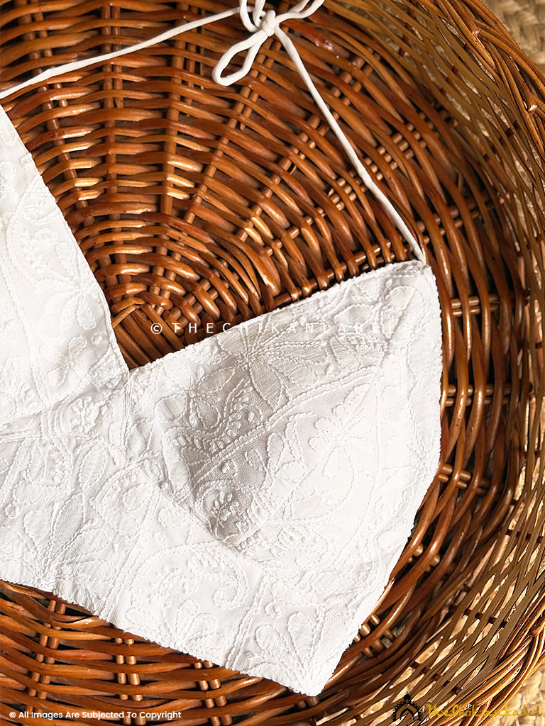 Close-up of lightweight viscose chikankari blouse with intricate floral embroidery and tie-up back detail