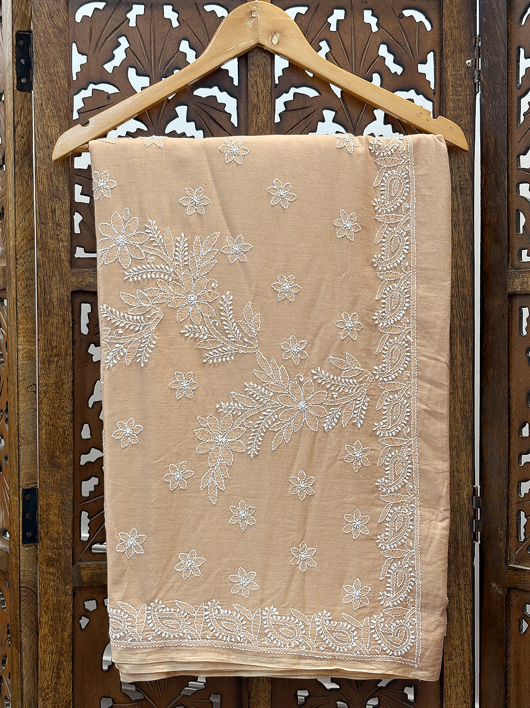 Ethnic saree crafted in mulmul cotton fabric featuring delicate hand embroidery inspired by classic Chikankari craftsmanship.