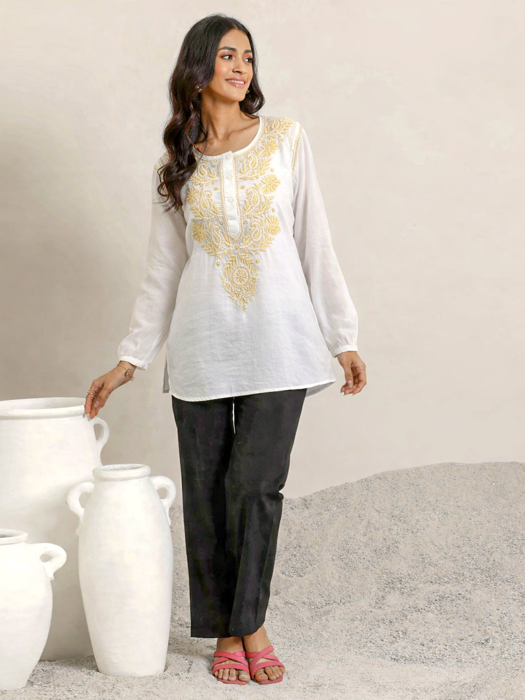 Women’s chikankari top featuring detailed hand embroidery and a classic silhouette, perfect for pairing with trousers or palazzos for a refined look.