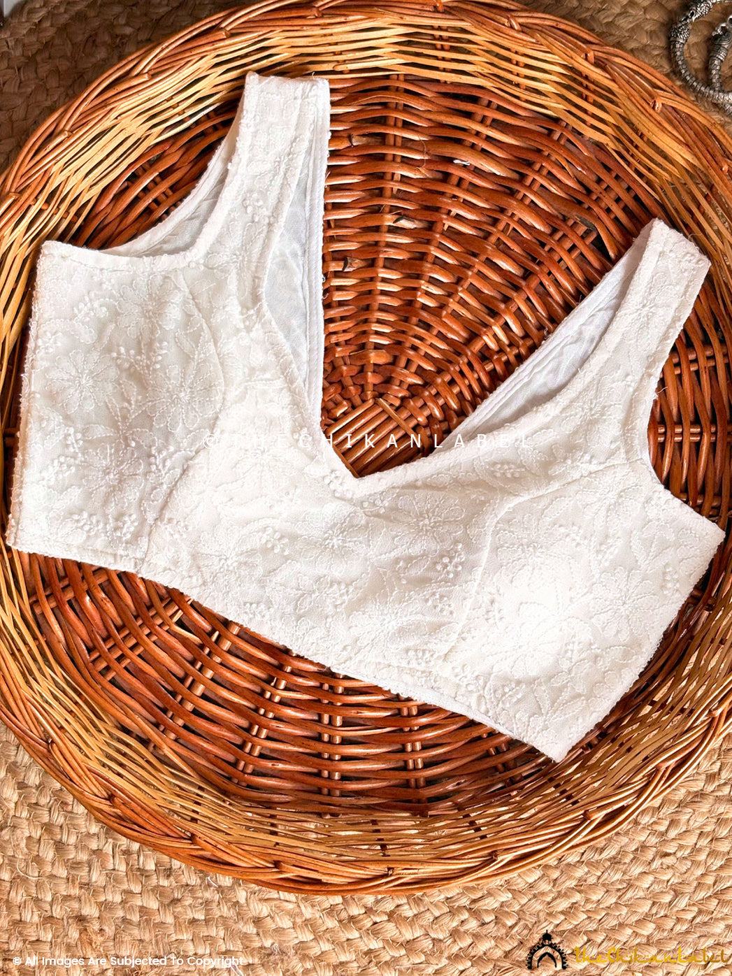 Fashionable blouse with Lucknowi chikankari detailing suitable for pairing with lehengas and sarees