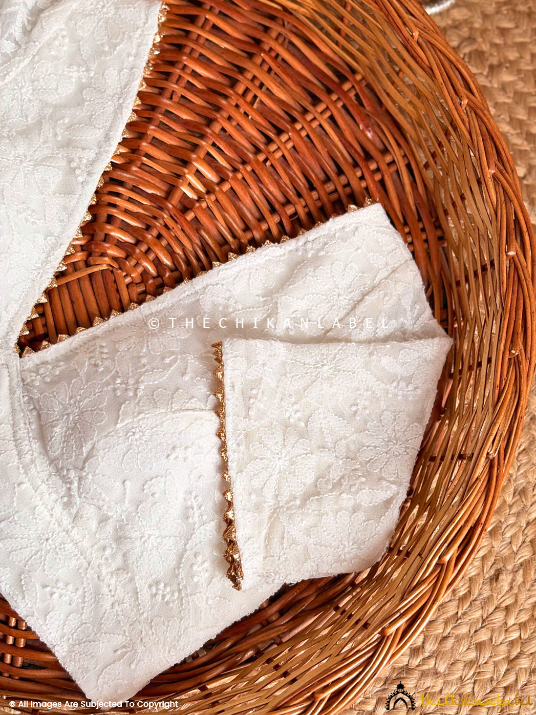 Artisan-crafted Chikankari blouse with boat neckline and intricate thread embroidery suitable for saree styling